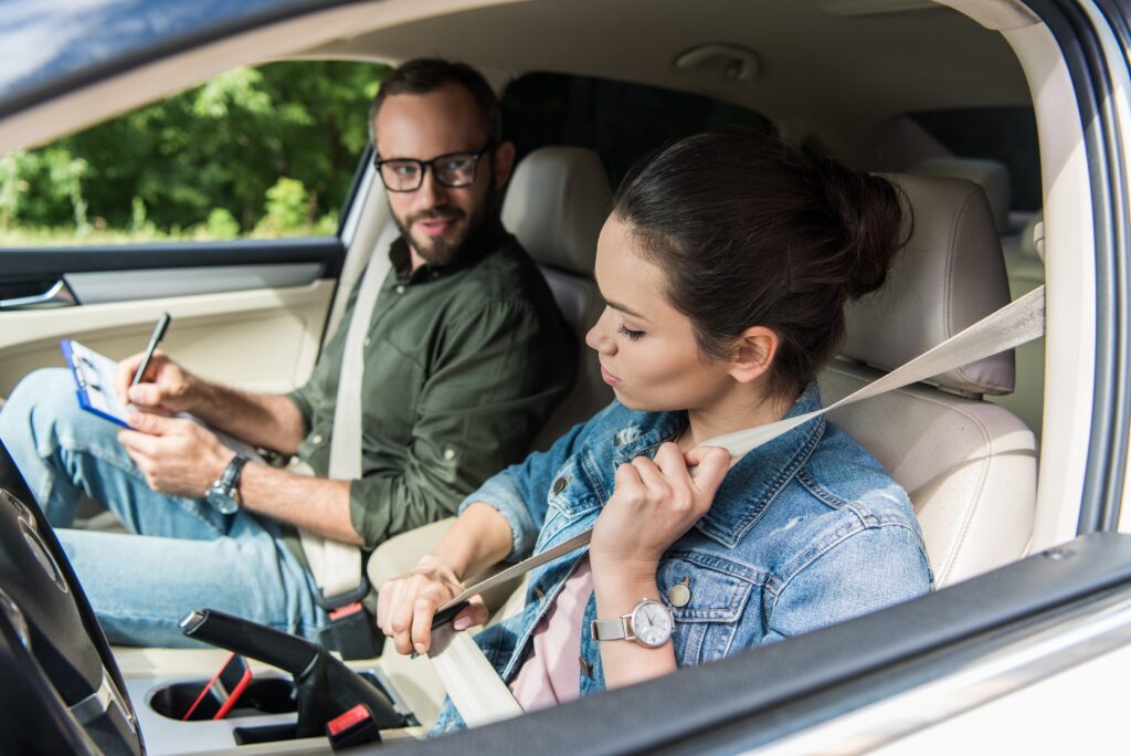 Learner driver fastening seat belt before a VicRoads driving test taken as part of a Lesson + Test package