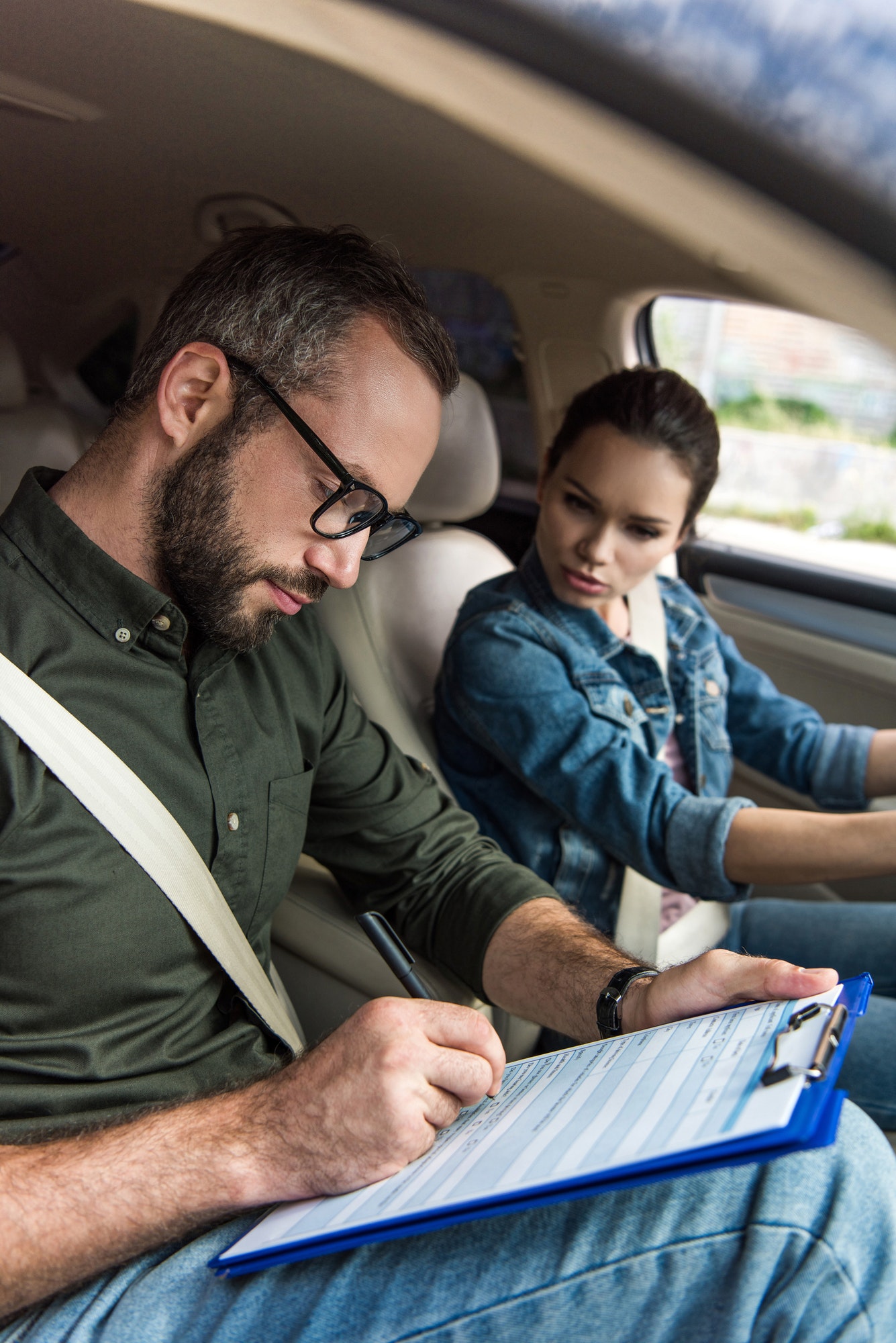 Mitcham Driving School instructor recording a learner's progress on a VicRoads pre-test warm-up assessment