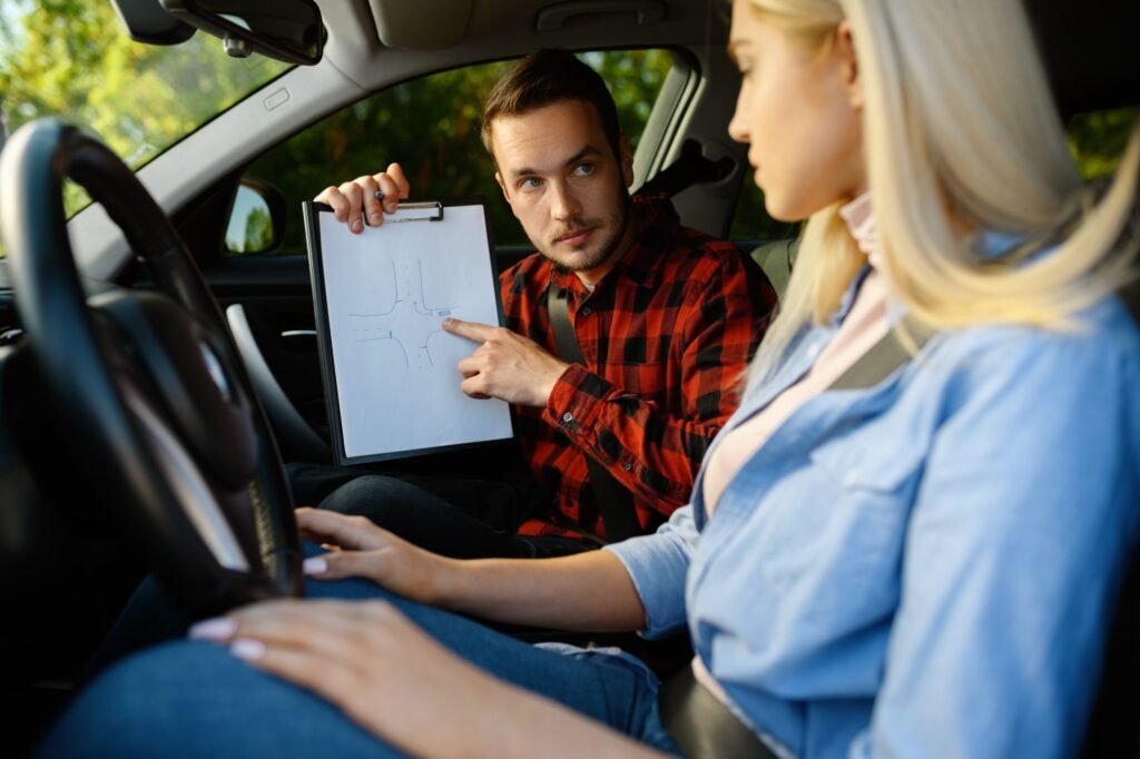 Driving instructor reviewing a pre-lesson checklist with a student