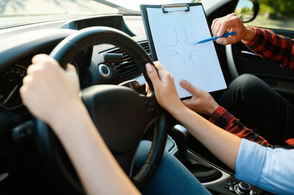 Mitcham Driving School learner with their instructor checking the booking checklist for a lesson package